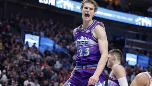 Utah Jazz forward Lauri Markkanen (23) reacts to dunking the ball during the second half against the Oklahoma City Thunder at Vivint Arena.
